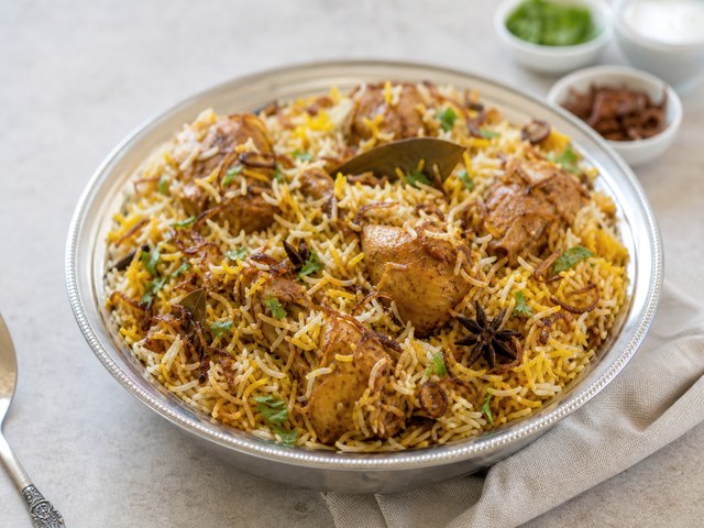 Golden chicken biryani catering platter